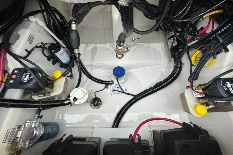 Slide: The Image of Engine compartment of 2025 Regulator 24XO boat, showcasing wiring and components. - 8