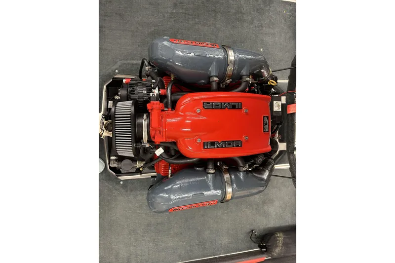 Slide: The Image of 2015 MasterCraft ProStar Ilmor engine, red and gray components, top view. - 7