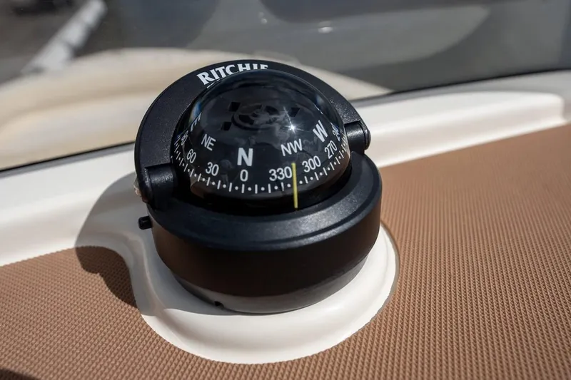 Slide: The Image of Compass on 2026 Scout 188 Sportfish boat dashboard, displaying cardinal directions. - 10
