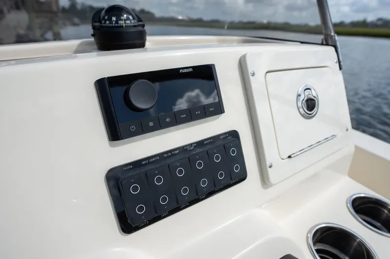 Slide: The Image of Control panel of 2026 Scout 188 Sportfish boat with navigation and audio system. - 12