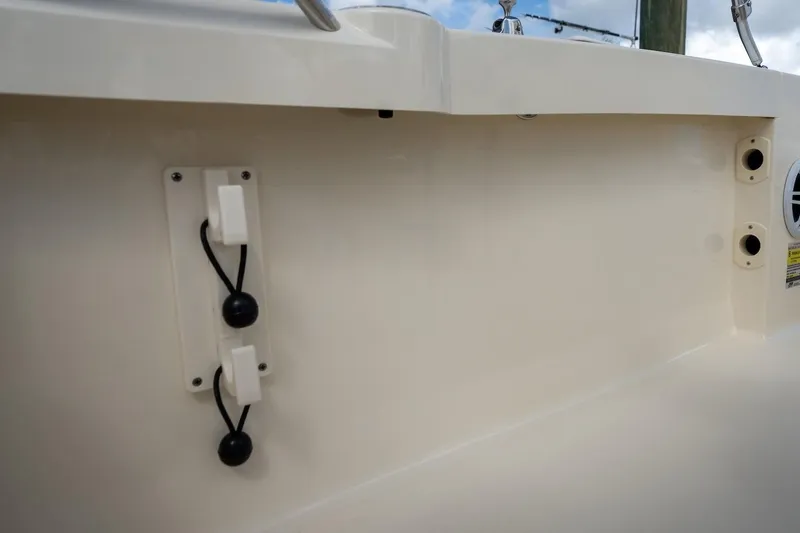 Slide: The Image of 2026 Scout 188 Sportfish boat interior detail with utility hooks and fittings. - 13