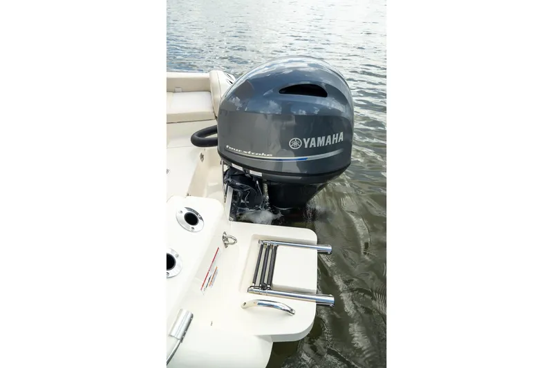 Slide: The Image of 2026 Scout 188 Sportfish with Yamaha outboard motor on calm water. - 14
