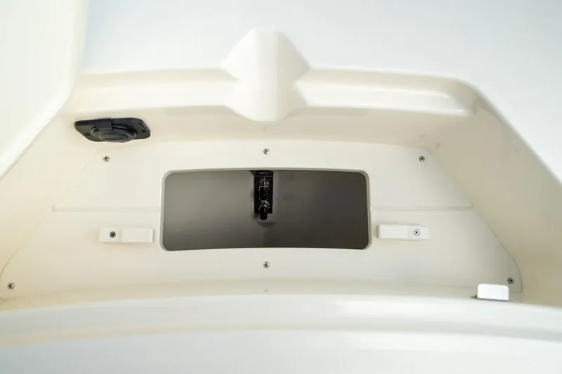 Slide: The Image of 2026 Scout 188 Sportfish boat storage compartment, featuring a sleek, white interior design. - 16