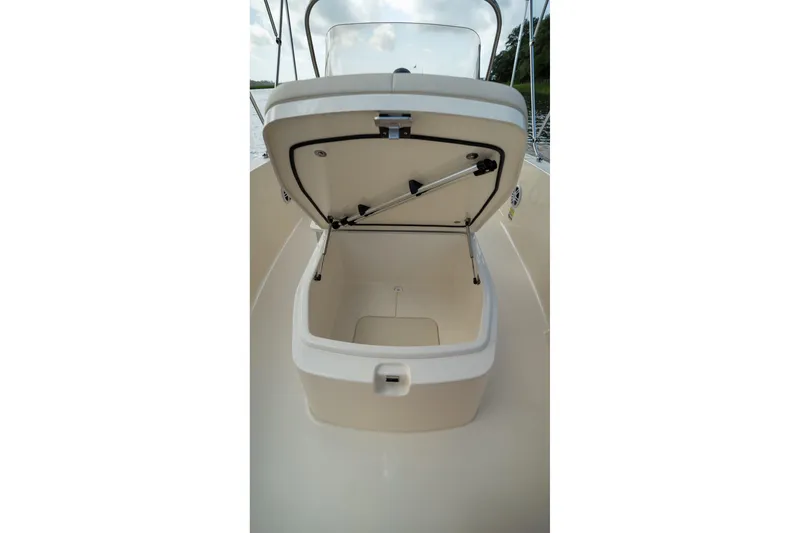Slide: The Image of Open storage compartment on 2026 Scout 188 Sportfish boat, showcasing interior space. - 17
