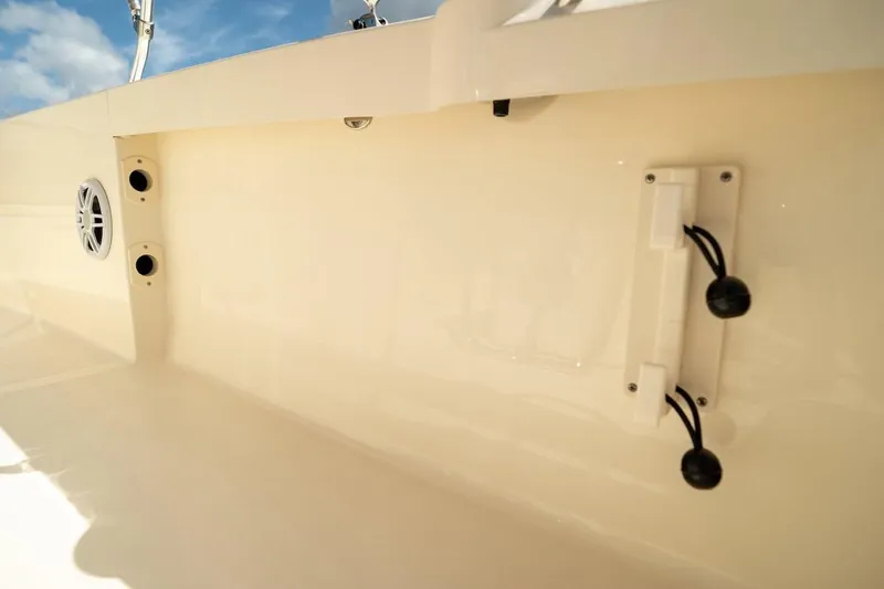 Slide: The Image of 2026 Scout 188 Sportfish interior detail with speaker and rod holder. - 20