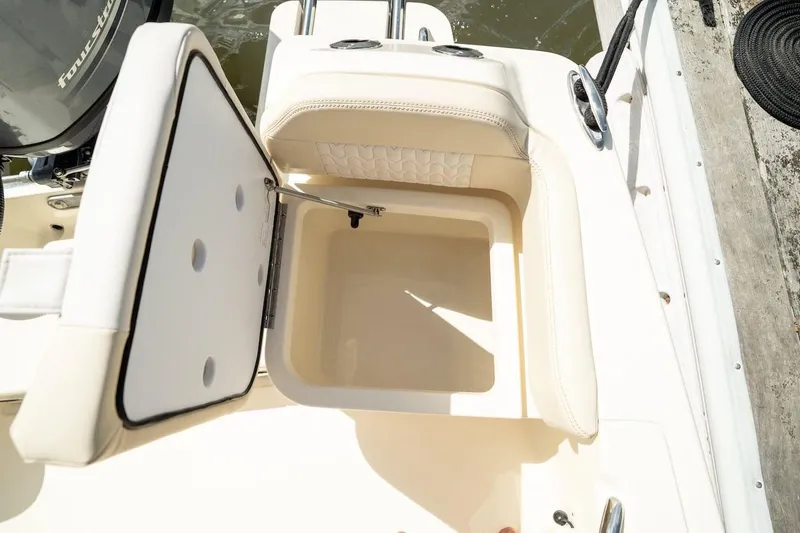 Slide: The Image of Open storage compartment on 2026 Scout 188 Sportfish boat, showcasing interior design. - 22