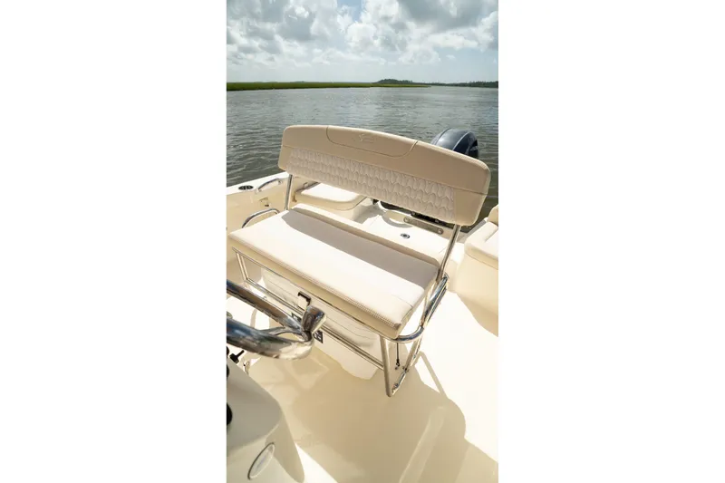 Slide: The Image of 2026 Scout 188 Sportfish boat seat with elegant design on calm water. - 23