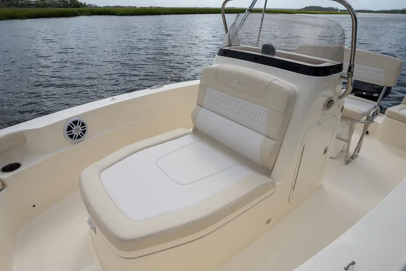 Slide: The Image of 2026 Scout 188 Sportfish boat interior with comfortable seating and sleek design on the water. - 8
