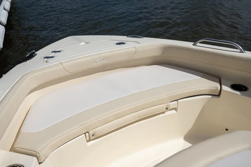Slide: The Image of 2026 Scout 188 Sportfish boat interior with cushioned seating and cup holders. - 9