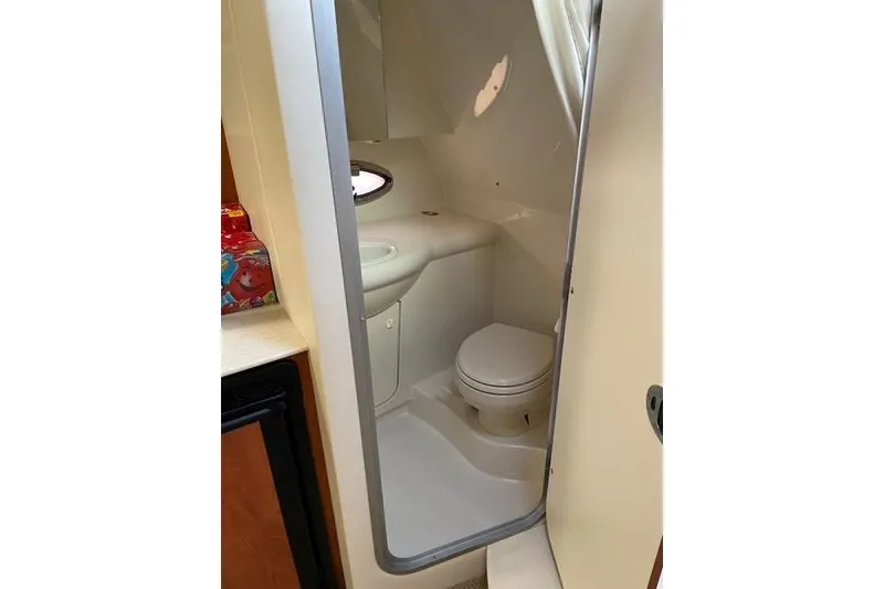 Slide: The Image of 2007 Bayliner 325 boat bathroom with toilet and sink. - 8