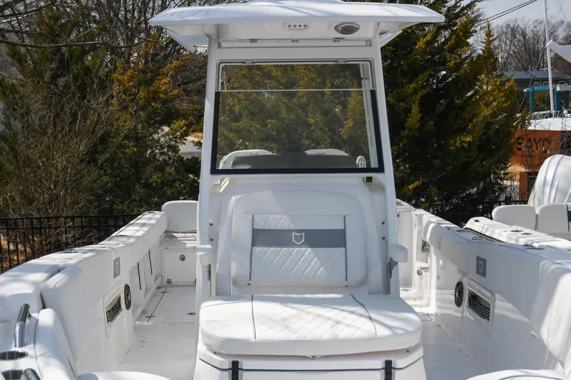 Slide: The Image of 2026 Sea Fox 268 Commander boat interior with white seating and console. - 4