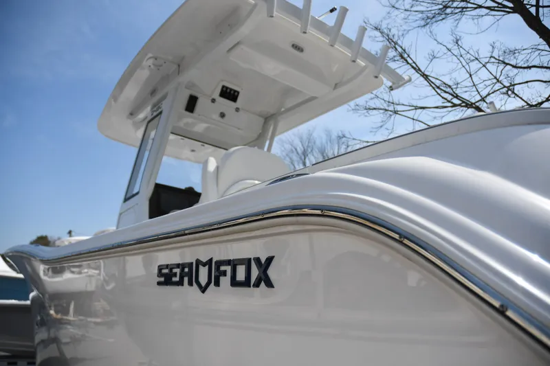 Slide: The Image of 2026 Sea Fox 268 Commander boat, sleek design under clear blue sky. - 16