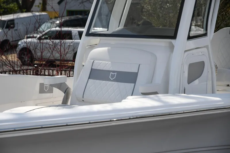 Slide: The Image of 2026 Sea Fox 268 Commander boat interior with white seating and modern design. - 6