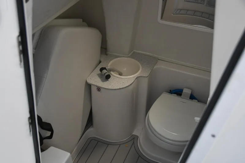 Slide: The Image of Interior of 2026 Sea Fox 268 Commander boat featuring compact bathroom amenities. - 8