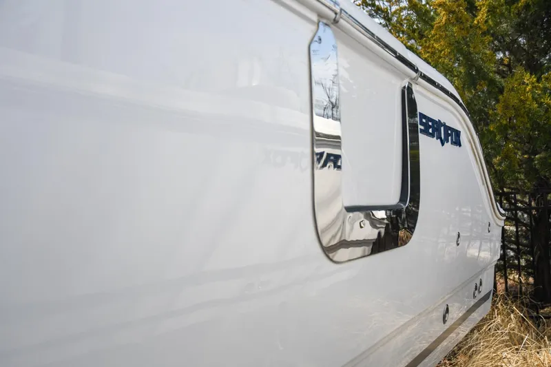 Slide: The Image of 2026 Sea Fox 268 Commander boat side view with sleek design and chrome accents. - 17