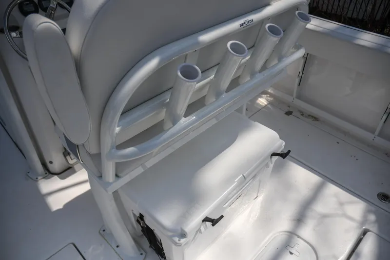 Slide: The Image of 2026 Sea Fox 268 Commander boat interior with rod holders and storage compartment. - 13