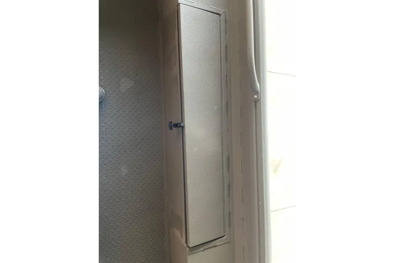 Slide: The Image of Storage compartment on 2026 Reaper Boats 753 Timber Reaper, featuring a secure latch and durable design. - 10