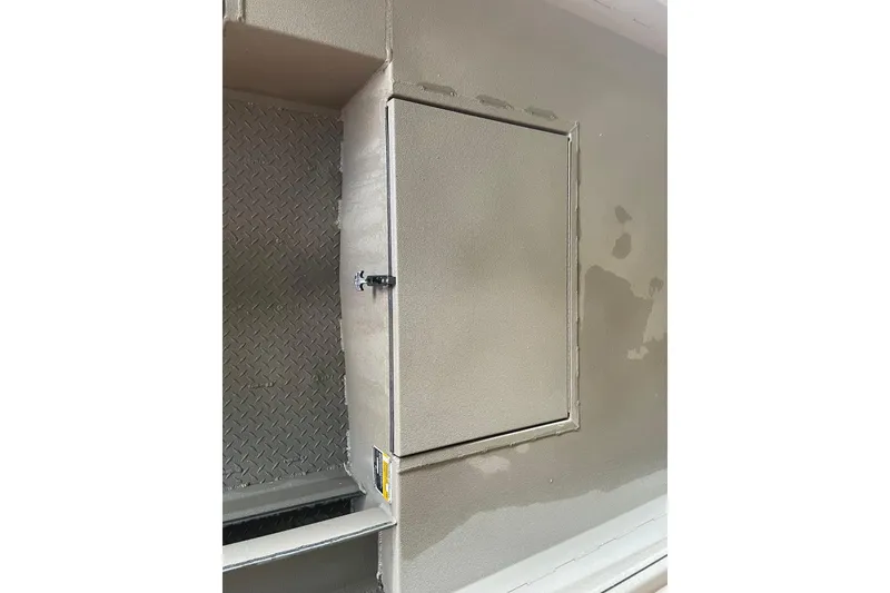 Slide: The Image of Storage compartment on 2026 Reaper Boats 753 Timber Reaper, featuring a secure latch and rugged design. - 11