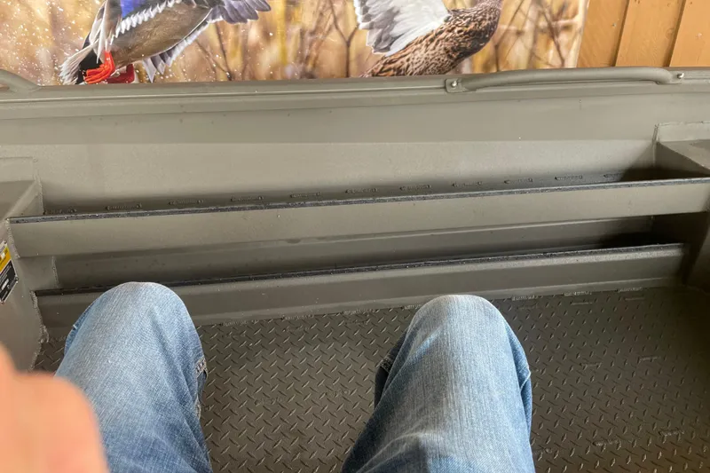 Slide: The Image of Interior view of a 2026 Reaper Boats 753 Timber Reaper with diamond-pattern flooring. - 13