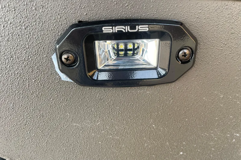 Slide: The Image of LED light fixture on 2026 Reaper Boats 753 Timber Reaper, featuring Sirius branding. - 5