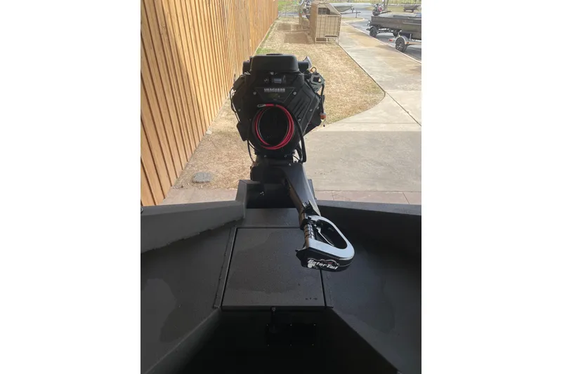 Slide: The Image of 2026 Reaper Boats 753 Timber Reaper with advanced motor, docked outdoors. - 9