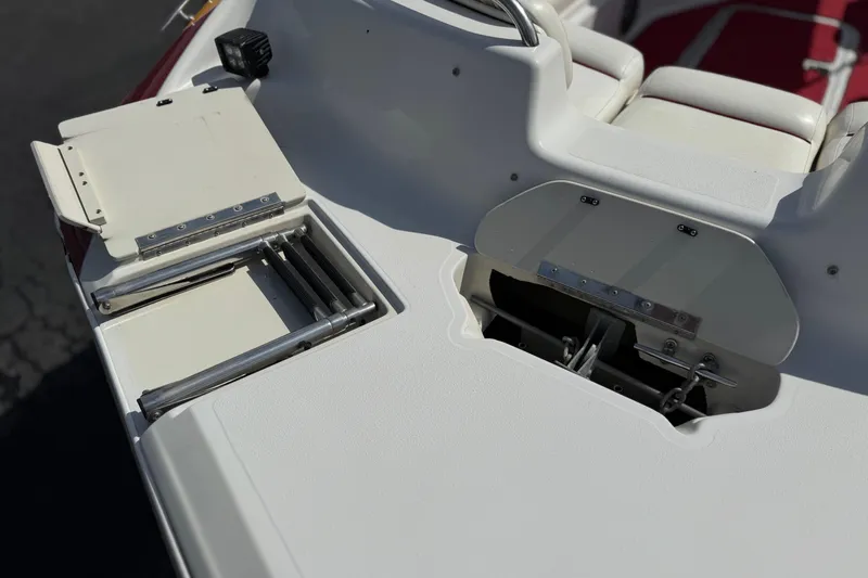 Slide: The Image of Godfrey 248 Fundeck 2000 boat deck with ladder and seating area. - 11