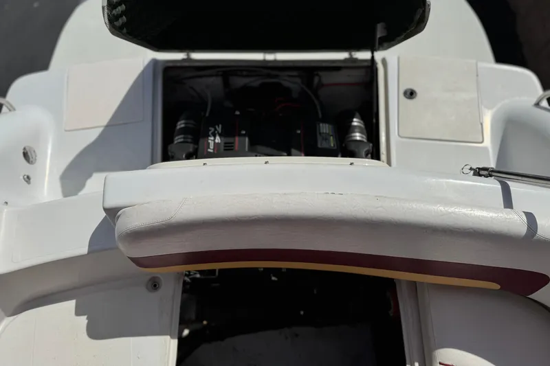 Slide: The Image of 2000 Godfrey 248 Fundeck boat engine compartment with open hatch. - 25