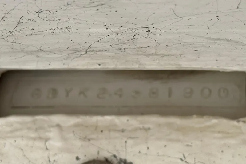 Slide: The Image of Close-up of a Godfrey 248 Fundeck 2000 model hull identification number. - 38