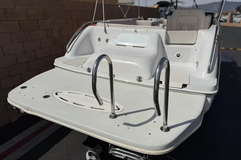 Slide: The Image of Rear view of a 2000 Godfrey 248 Fundeck boat with swim platform and ladder. - 6