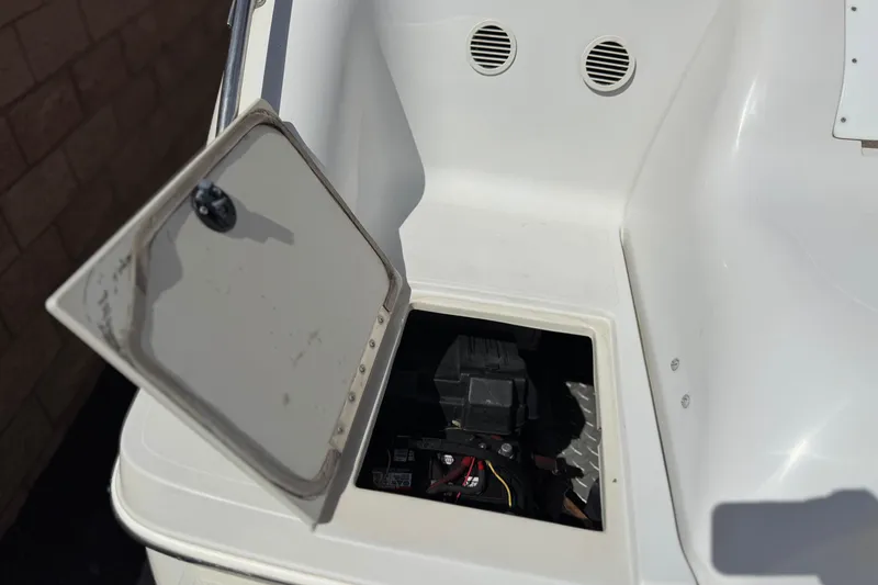 Slide: The Image of Open hatch on a 2000 Godfrey 248 Fundeck boat, revealing internal components. - 7