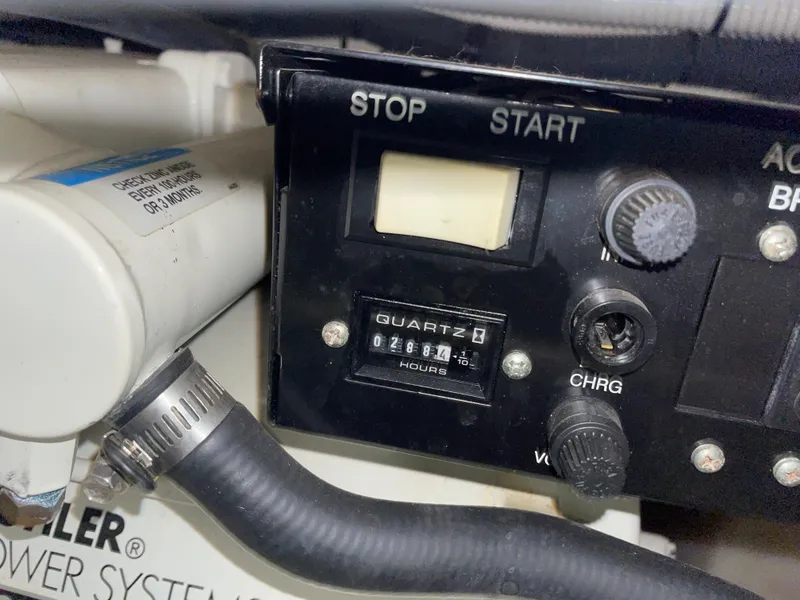 Slide: The Image of Control panel of a 2005 Sea Ray 280 Sundancer boat engine. - 16