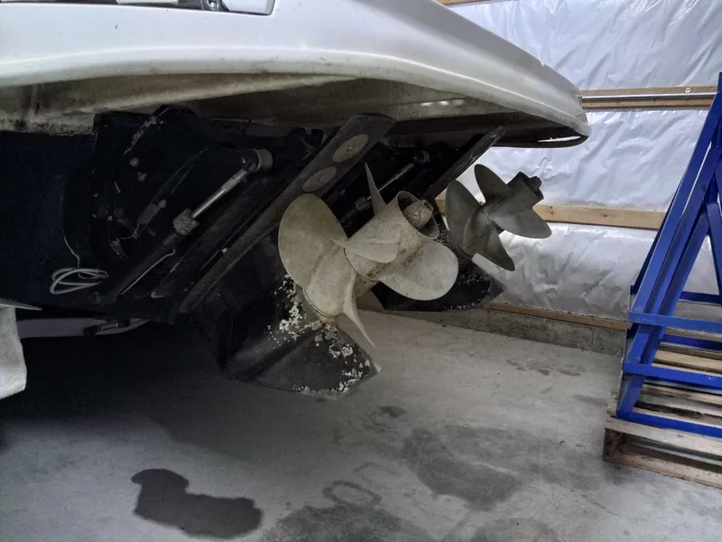 Slide: The Image of 2005 Sea Ray 280 Sundancer boat propellers in a garage setting. - 8