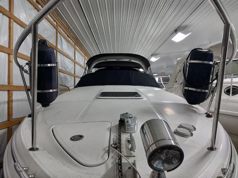 Slide: The Image of 2005 Sea Ray 280 Sundancer boat in indoor storage facility. - 9