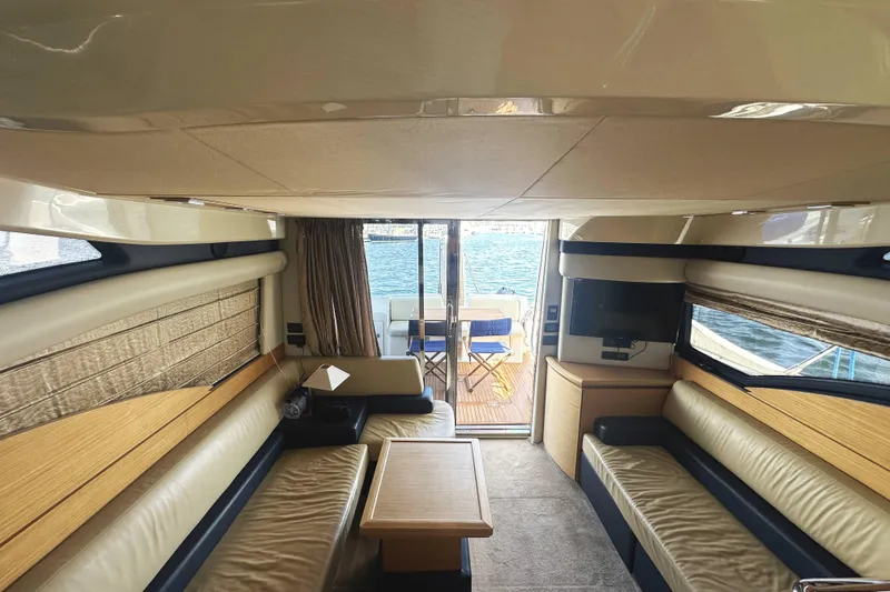 Slide: The Image of Luxurious interior of a 2007 Azimut 43 yacht with elegant seating and waterfront view. - 19
