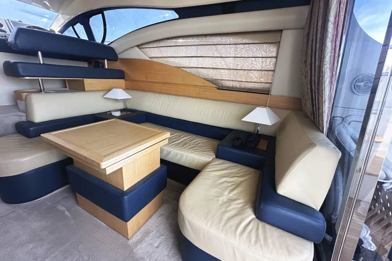 Slide: The Image of Luxurious interior of a 2007 Azimut 43 yacht with elegant seating and wooden table. - 20