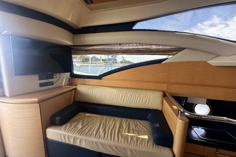 Slide: The Image of Interior of 2007 Azimut 43 yacht with leather seating and window view. - 21