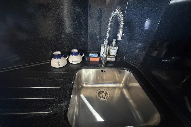 Slide: The Image of Stainless steel sink with modern faucet in 2007 Azimut 43 yacht kitchen. - 34