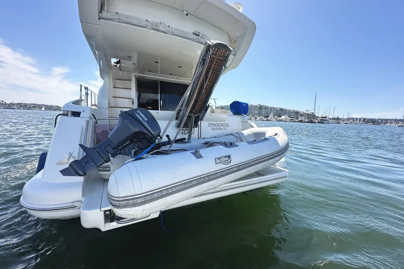 Slide: The Image of 2007 Azimut 43 yacht with dinghy and Yamaha motor on calm waters. - 4