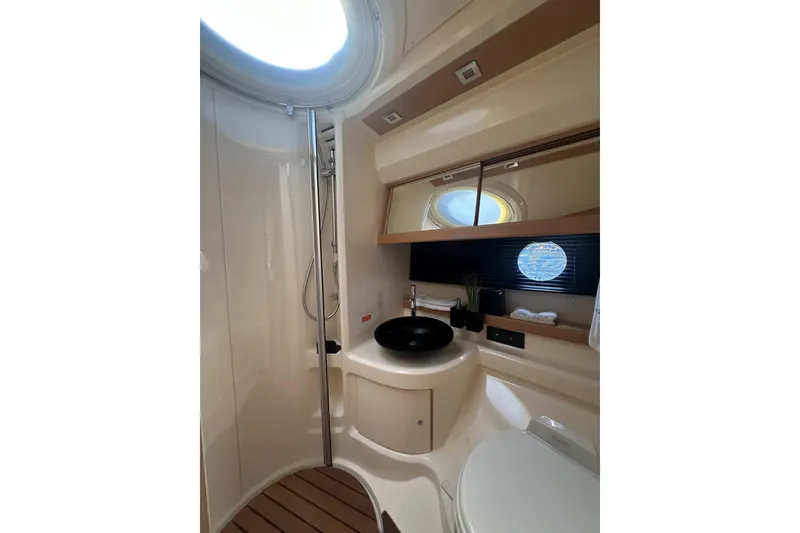 Slide: The Image of Luxurious bathroom interior of 2007 Azimut 43 yacht with modern fixtures and porthole window. - 41