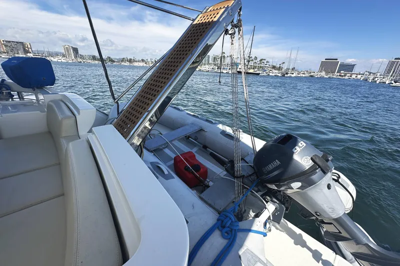 Slide: The Image of 2007 Azimut 43 yacht with Yamaha motor, docked in a marina under clear skies. - 5