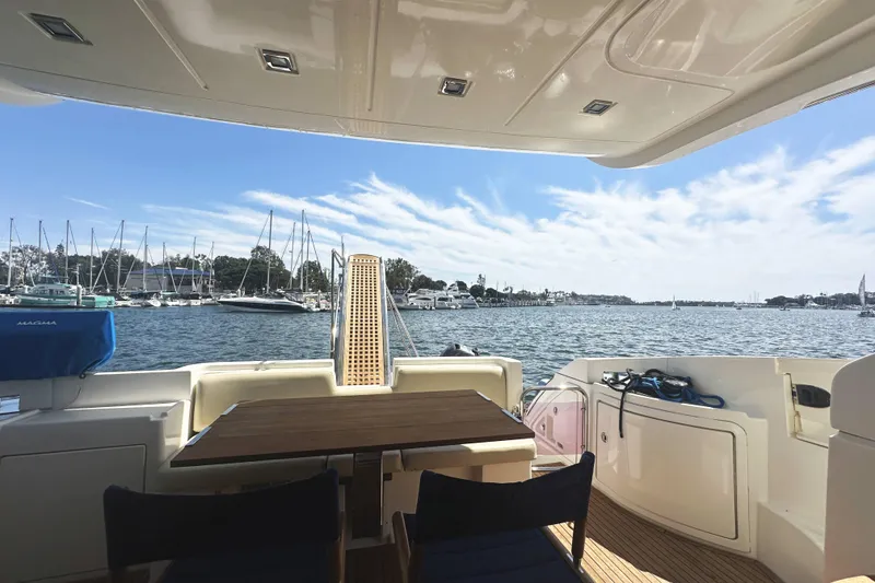 Slide: The Image of View from 2007 Azimut 43 yacht, overlooking marina with sailboats and clear blue sky. - 6