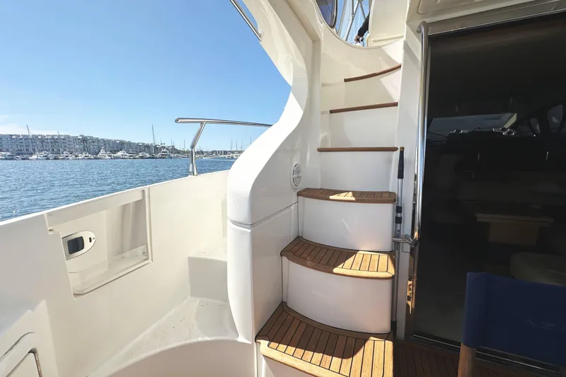 Slide: The Image of Staircase on 2007 Azimut 43 yacht with marina view in the background. - 9