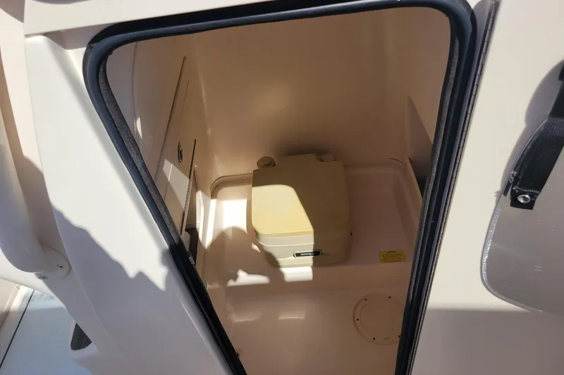 Slide: The Image of 2017 Grady-White 251 Coastal Explorer boat interior with compact toilet compartment. - 10