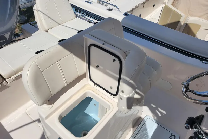 Slide: The Image of 2017 Grady-White 251 Coastal Explorer boat interior with open storage compartment. - 14