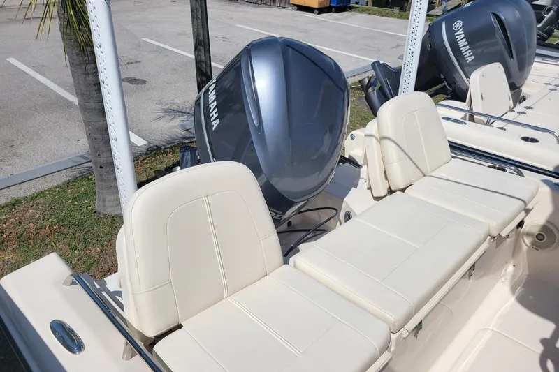 Slide: The Image of 2017 Grady-White 251 Coastal Explorer boat with Yamaha outboard motor and beige seating. - 15
