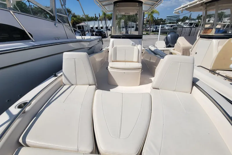 Slide: The Image of 2017 Grady-White 251 Coastal Explorer boat interior with white seating and console. - 6