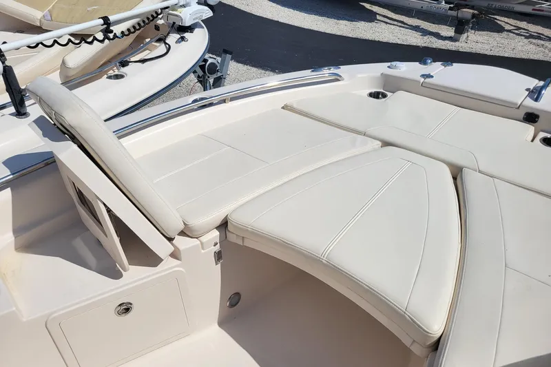 Slide: The Image of 2017 Grady-White 251 Coastal Explorer boat interior with cushioned seating. - 8