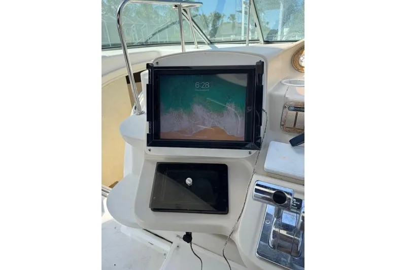 Slide: The Image of 1999 Cruisers 3870 Express dashboard with mounted tablet and control panel. - 10