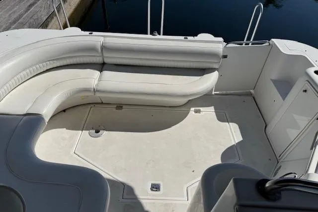 Slide: The Image of 1999 Cruisers 3870 Express boat with spacious white seating area. - 8
