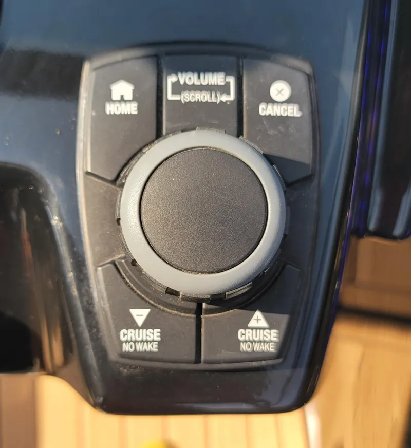 Slide: The Image of Control panel of a 2021 Yamaha Boats 252SD, featuring volume and cruise settings. - 25